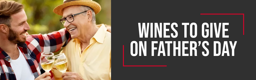 Father and son toasting with white wine outdoors, with the title Wines to give on Father's Day