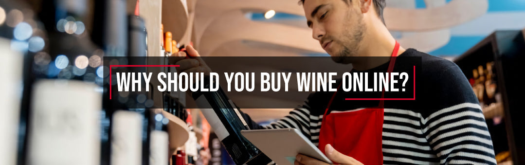 Shop assistant in a red apron checking stock on a tablet in a wine aisle, with the title Why should you buy wine online