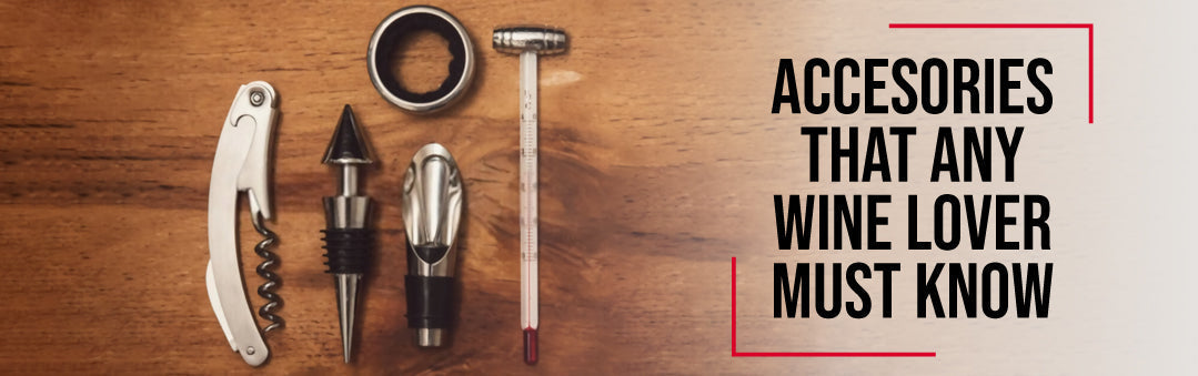 Corkscrew, stopper, pourer, foil cutter and wine thermometer laid out on wood, with the title Accessories that any wine lover must know
