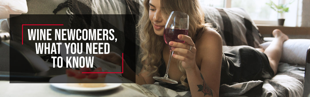 Woman relaxing at home with a glass of red wine and a laptop, with the title Wine newcomers, what you need to know