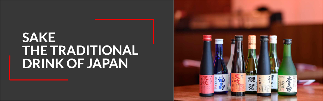 Six bottles of Japanese sake arranged on a wooden table, with the title Sake, the traditional drink of Japan